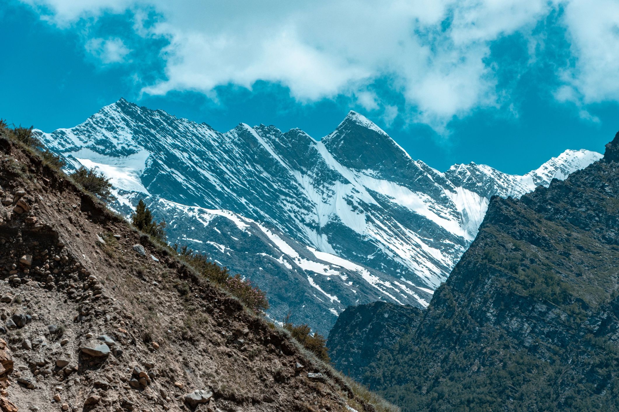 Snow-covered Himalayan range under warm light