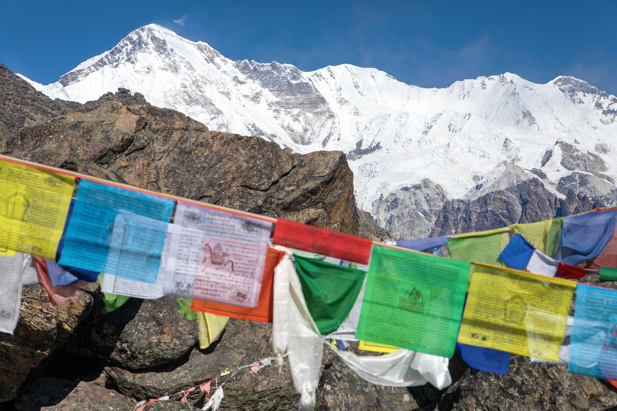 Prayer flags with Himalayan mountain views