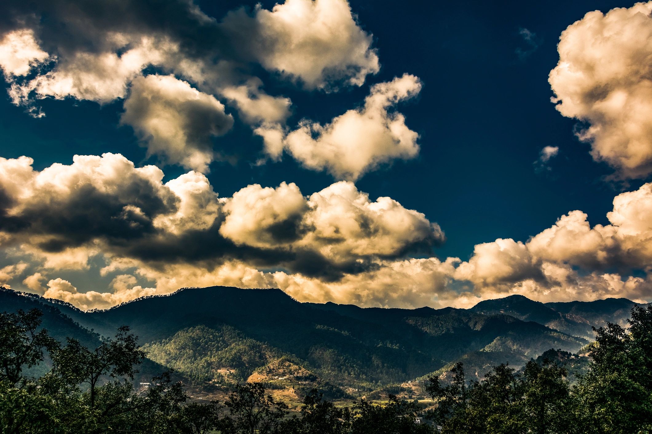 Mountain landscape in the Himalayas with clouds